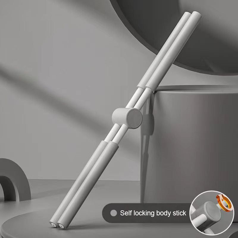 A gray Yoga Stick with a double-rod design and central rotating joint leans against a cylindrical object. An inset highlights the self-locking joint. The background is minimalistic and shadowed.