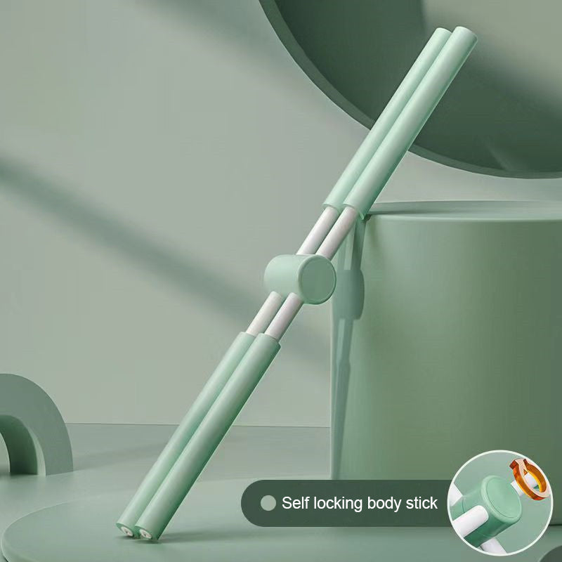 A green Yoga Stick with a central hinge is propped against a rounded object. An inset gives a close-up of the hinge mechanism. Text reads: Yoga Stick.